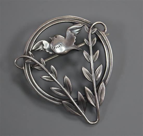 A Danish Georg Jensen sterling songbird and foliage circular brooch, no.258, 39mm.